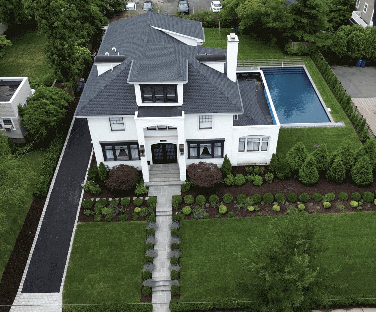 Aerial view of a modern white house.