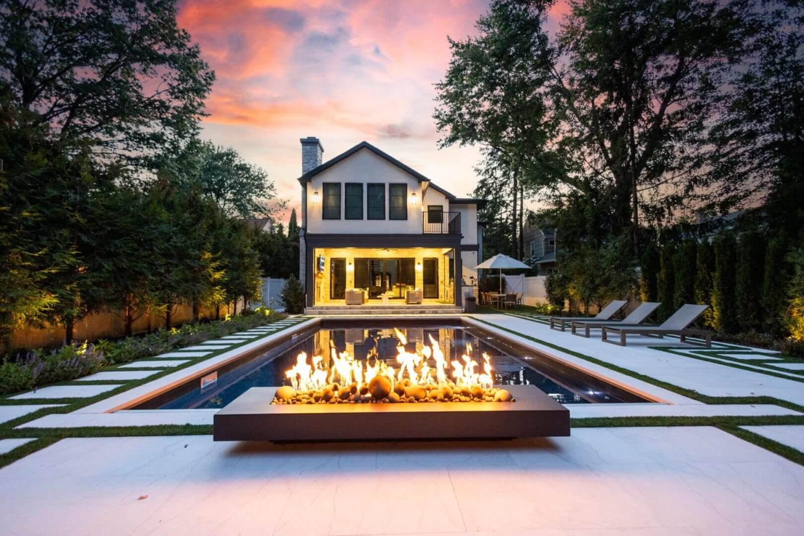 Modern backyard with pool and fire pit