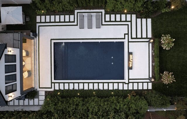 Aerial view of modern rectangular pool and patio