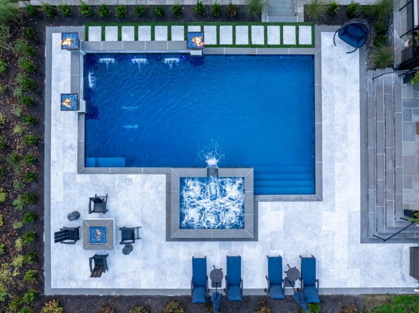 Aerial view of backyard pool with spa waterfall