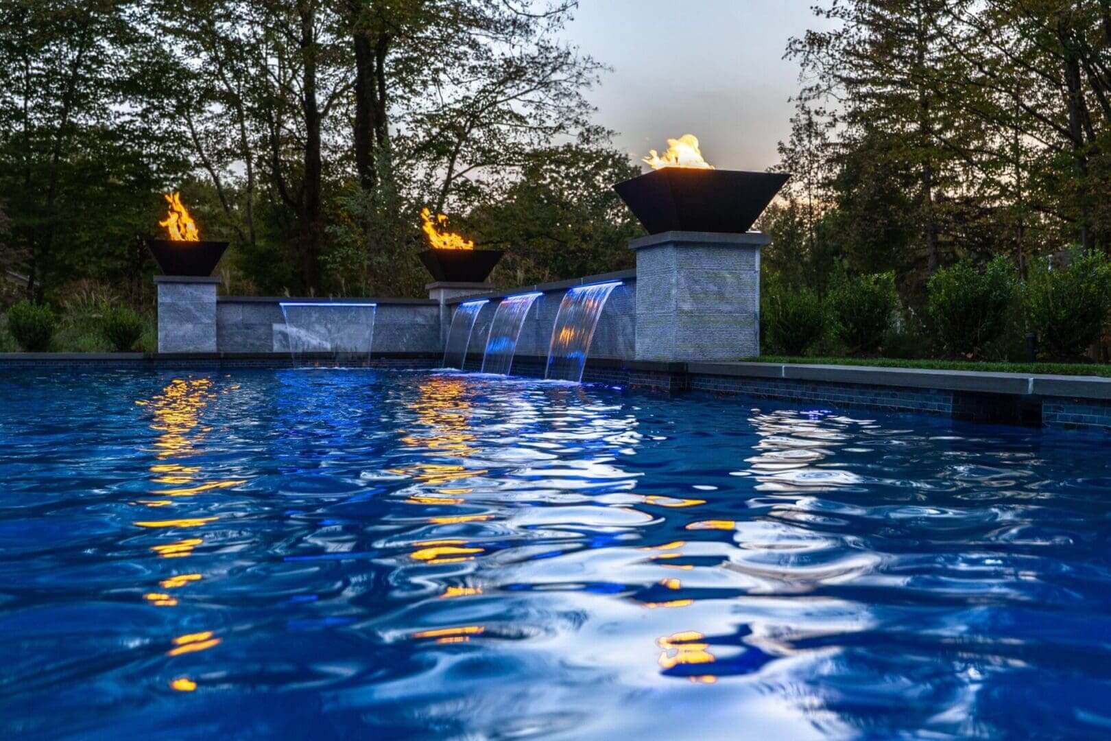 Luxury pool with fire bowls and waterfalls